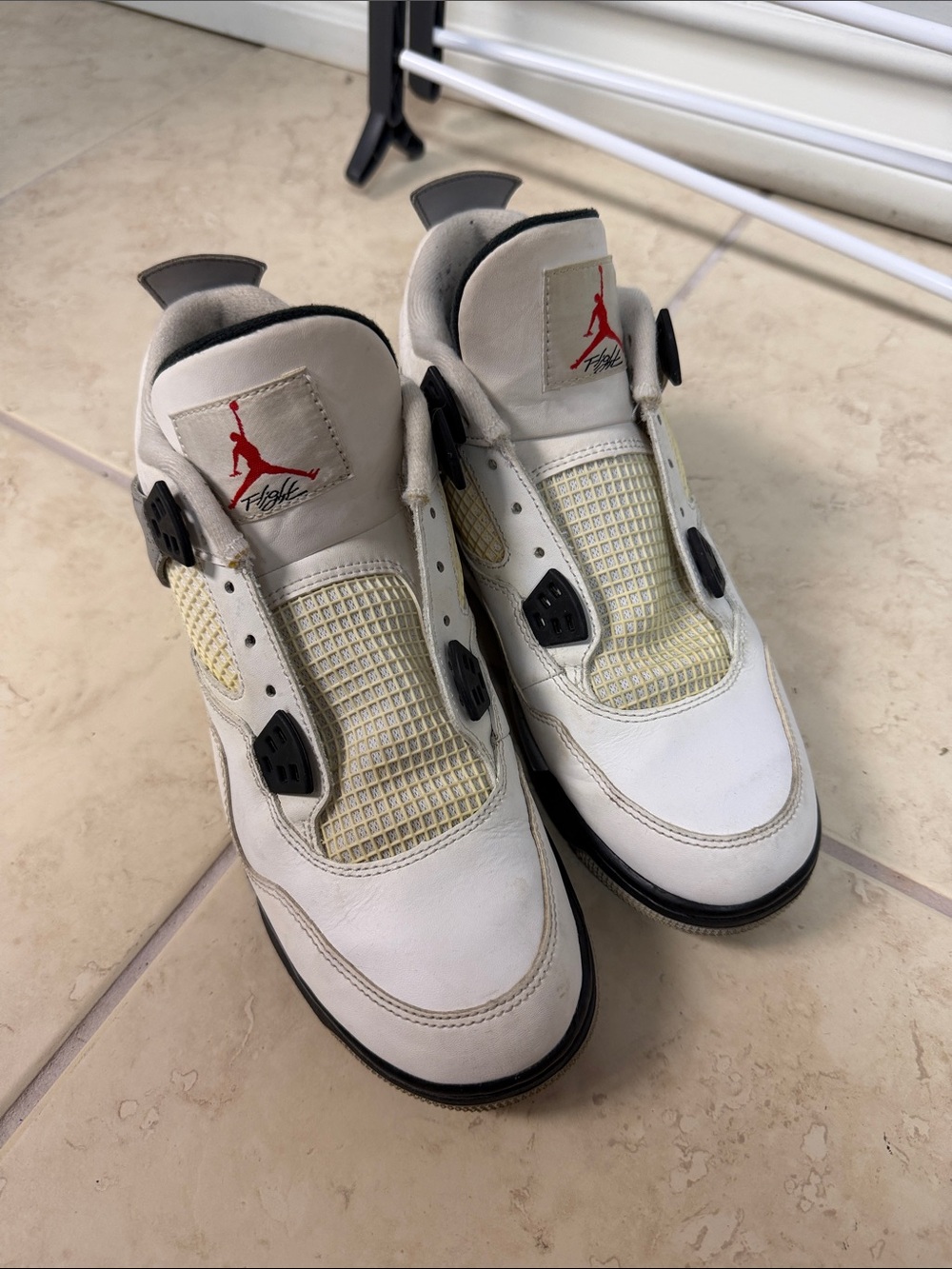 Jordan White and Black Retro 4 Sneakers with Red Jumpman